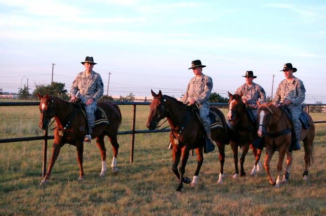 FORT HOOD, Texas-(From left to right) Lt. Gen. Michael Oates, Director of the Joint Improvised Explosive Device Defeat Organization, Maj. Gen. Daniel Allyn, commanding general of the 1st Cavalry Division, Lt. Col. Robert Magee, commander of 5th Batta...