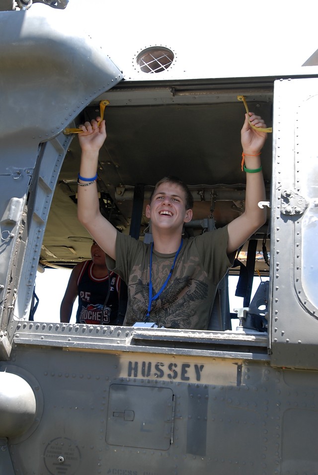 KILLEEN, Texas -  Logan Marek, 15, from Temple, Texas, relaxes in the shade of a Black Hawk helicopter during a static display set up by aviators from Company C, 3rd Assault Helicopter Battalion, 227th Aviation Regiment, 1st Air Cavalry Brigade,...