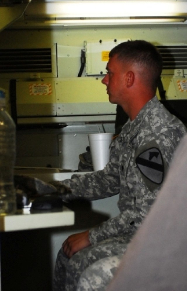 FORT HOOD, Texas- Spc. James Zehr, from Council Grove, Kan., a radar operator for Headquarters and Headquarters Battery, 3rd Battalion, 82nd Field Artillery Regiment, 2nd Brigade Combat Team, 1st Cavalry Division, receives instruction for radar...