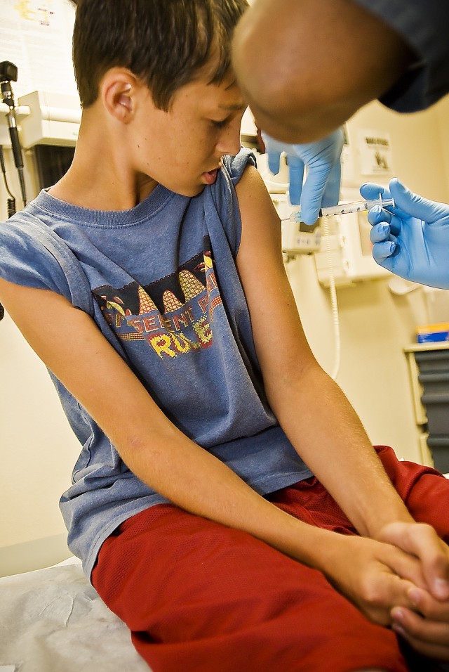 FORT HOOD, Texas-Audie Murphy Middle School student, Christiopher Parker, recieves his last of three back to school immunizations, Aug. 14, at the Thomas Moore Health Clininc. This free service for Fort Hood students offered by the 1st Cavalry Divisi...