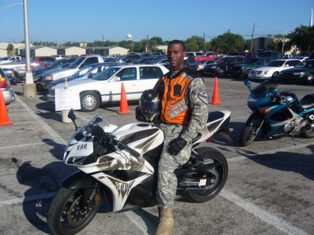 FORT HOOD, Texas-Staff Sgt. Cornell Reddick, of Chicago, assigned to 1st Battalion, 82nd Field Artillery Regiment, 1st Brigade Combat Team, 1st Cavalry Division, demonstrates the proper way to wear personal protective equipment while riding. A...