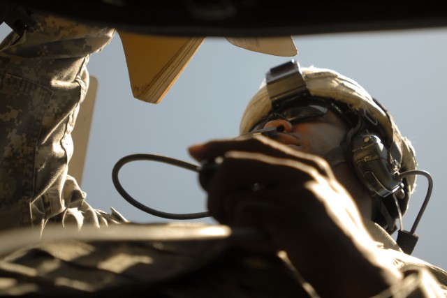 FORT HOOD, Texas- Sgt. Darren Woods, a recon security detachment member with 215th Brigade Support Battalion, 3rd Brigade Combat Team, 1st Cavalry Division, calls for a simulated medical evacuation, Aug. 20, for his vehicles gunner. For the first...