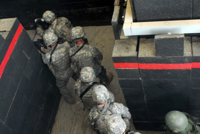 FORT HOOD, Texas- Military policemen from the 2nd Special Troops Battalion, 2nd Brigade Combat Team, 1st Cavalry Division, practice dynamic entry tactics and room clearing drills during the Special Reaction Team phase one training at the Fort Hood...
