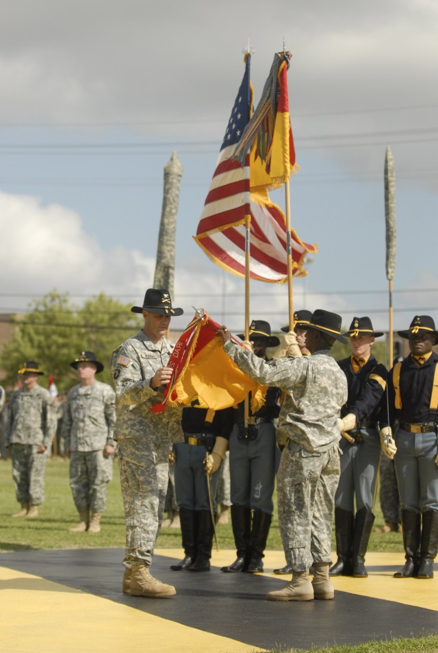 FORT HOOD, Texas- Col. Brian Winski (left), commander of the 4th Brigade Combat Team, 1st Cavalry Division, and 4th BCT Command Sgt. Maj. Antoine Overstreet prepare the Long Knife colors for casing in preparation for the brigade's deployment in...