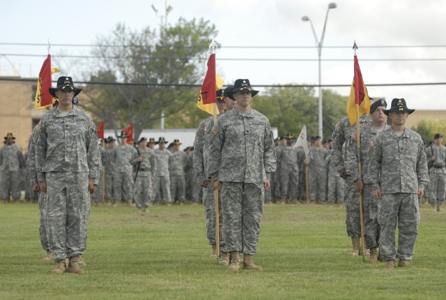 FORT HOOD, Texas- Stability Transition Team commanders from the 4th Brigade Combat Team, 1st Cavalry Division, stand in formation as their units are formally activated during the brigade's color casing ceremony, Sept. 1. The STTs will effectively...