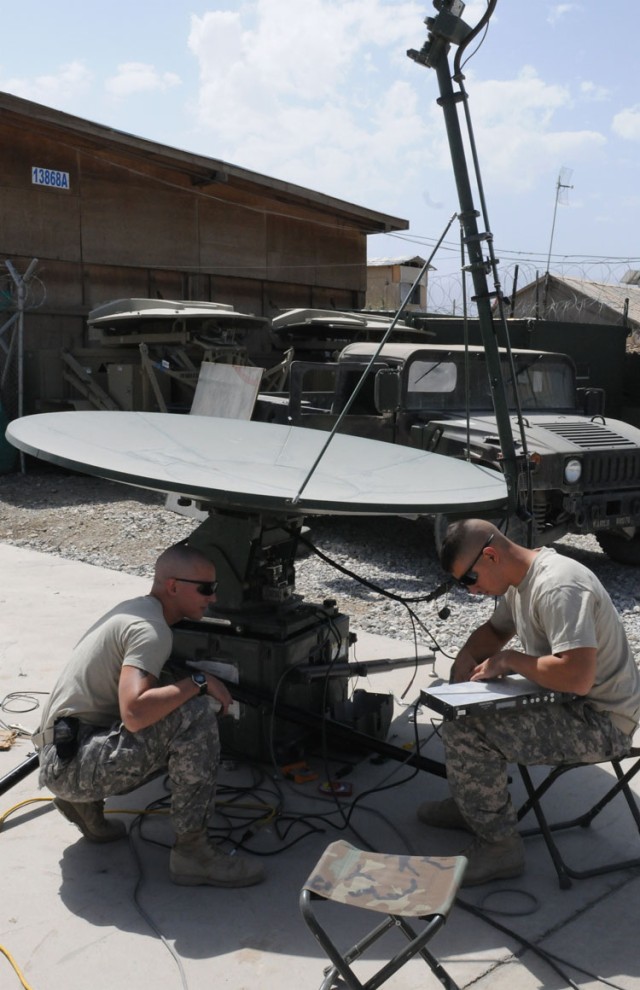 BAGRAM AIRFIELD, Afghanistan - U.S. Army Sgt. Matthew S. Grey of Collinsville, Ill. (left), and U.S. Army Sgt. William M. Hemingway of Seabrook, Texas, both TT/SPOP trainers and r