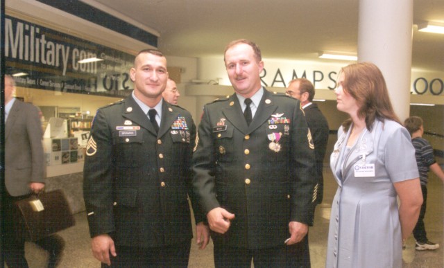 Sgt. 1st Class Walter Wood, middle, stands with Elaine Wood and Staff Sgt. Christopher Braman, during Wood's retirement Dec. 7, 2001. Braman was at the Pentagon during the 9/11 attacks and worked all night searching through the ashes of the...