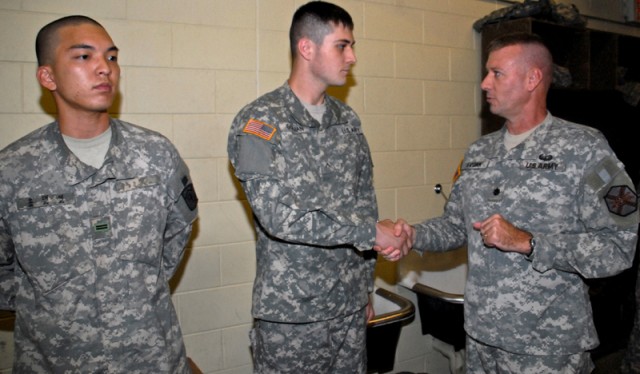 Military policemen aid injured Soldier
