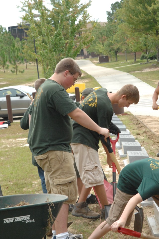 Boy Scouts from Troop 40, Fayetteville, N.C. landscape the new memorial walk for the 3rd Special Forces Group