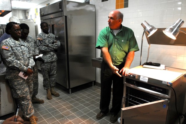 FORT HOOD, Texas-Soldiers from 2nd Brigade Combat Team, 1st Cavalry Division, watch and take notes while John Hever, an equipment demonstrator, shows them how a piece of new equipment works, Sept.17, at the new Black Jack Inn; slated to open at...