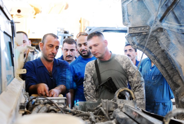 Soldiers train ISF on auto repair, preventative maintenance
