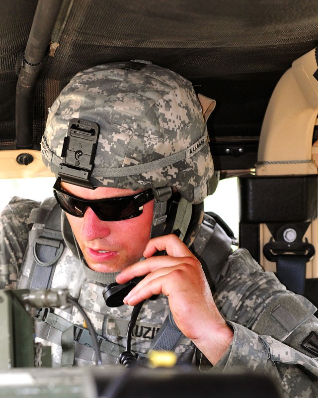 FORT HOOD, TEXAS - 2nd Lt. Alex Kuziel, a platoon leader in Company A, 589th Brigade Support Battalion, 41st Fires Brigade, calls a status report up to higher headquarters after taking enemy fire during a logistical patrol as part of a brigade field ...