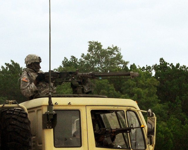 FORT HOOD, TEXAS - Pvt. 1st Class Lapoleon Hurell, a light-wheeled mechanic with Company B, 589th Brigade Support Battalion, 41st Fires Brigade, returns fire on enemy forces his convoy encountered on a logistical patrol during the brigades field trai...