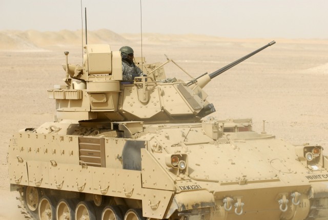 CAMP BUEHRING, Kuwait -Sgt. Martin Gaymon, a cavalry scout assigned to the 1st Squadron, 9th Cavalry Regiment, 4th Brigade, 1st Cavalry Division, zeroes his Bradley fighting vehicles weapon systems, Sept. 20.  Gaymon, a native of Long Island, N. Y., ...