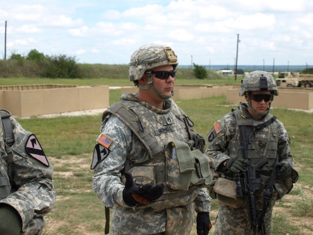 Fort Hood, Texas - Staff Sgt. Jerry Howell from East, Texas, squad leader for 3rd Platoon, Company B, 1st Brigade Combat Team, 1st Cavalry Division conducts a short class about room clearing and stacking in Urban Operations on Sept. 21. This...