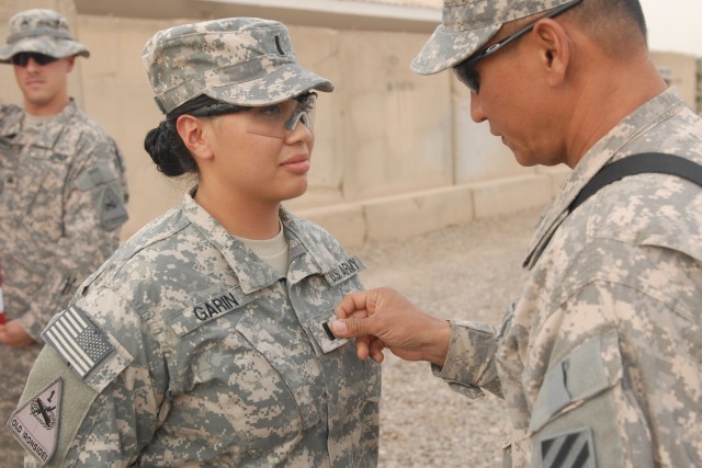 Father promotes daughter in Iraq