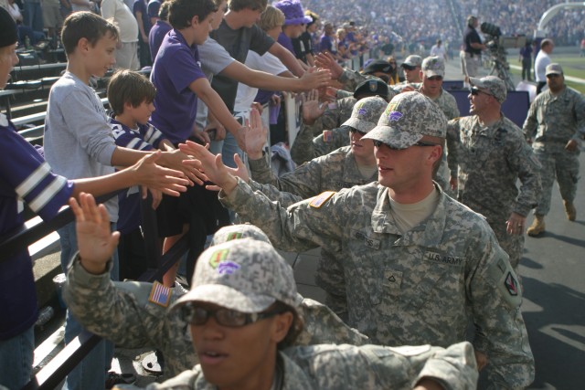 Game sets backdrop for Riley County, Fort Riley covenant signing