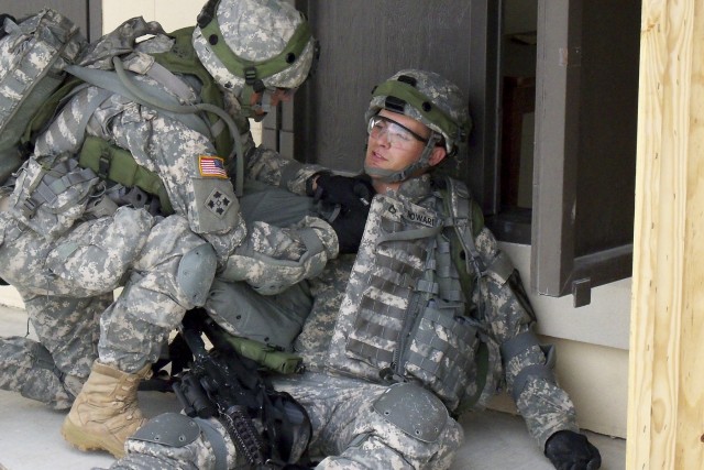 FORT HOOD, Texas - A Trooper from 6th Squadron 9th Cavalry Regiment, 3rd Brigade Combat Team, 1st Cavalry Division, evacuates a casualty while conducting a cordon and search at the Boaz Combined Arms Combat Training Facility as part of Greywolf...