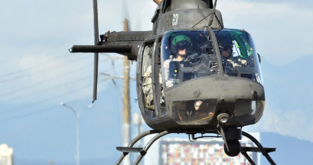 Brig. Gen. Renwick Payne, New York National Guard director of joint staff, and Chief Warrant Officer 3 Aaron Teichner, (front left) an aviator with Det. 1 A Co 1-224 Aviation Security and Support Battalion, fly in an OH-58 Kiowa Sept 22, at Air Force...