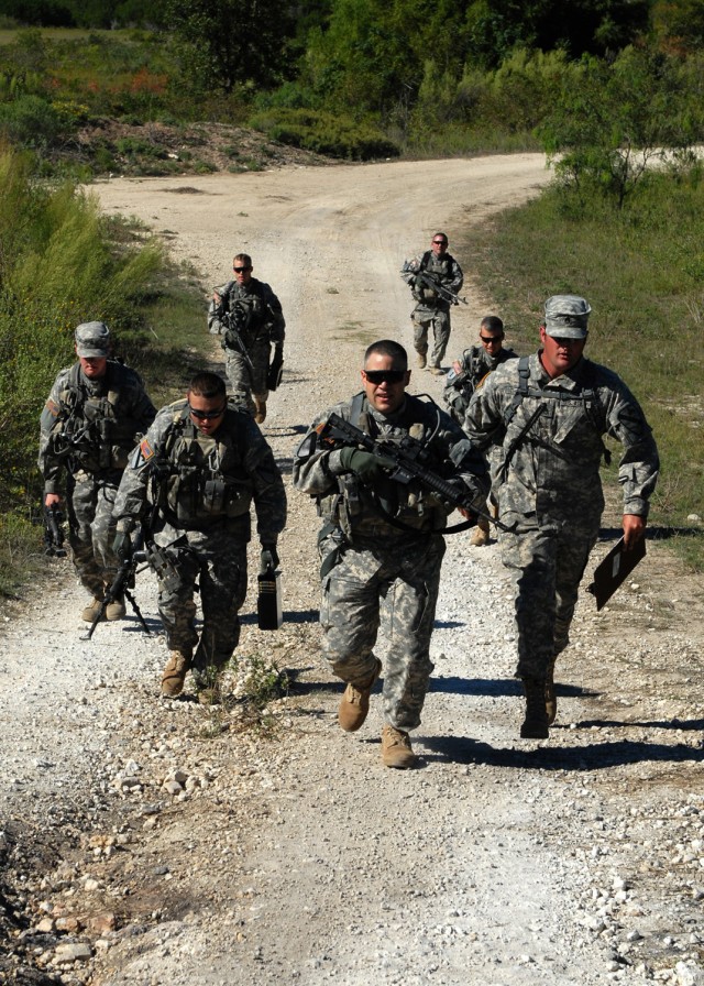 FORT HOOD, Texas - Soldiers from Company B, 2nd General Support Aviation Battalion, 227th Aviation Regiment, 1st Air Cavalry Brigade, 1st Cavalry Division, run from their simulated downed aircraft in full tactical load in order to make it on time...
