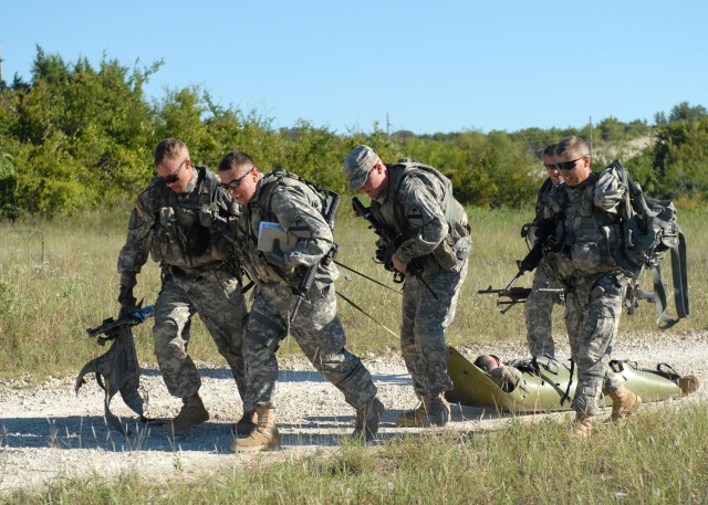 FORT HOOD, Texas - Soldiers from  2nd General Support Aviation Battalion, 227th Aviation Regiment, 1st Air Cavalry Brigade, 1st Cavalry Division, run while transporting a simulated injured crew member from one point to the medical evacuation site dur...