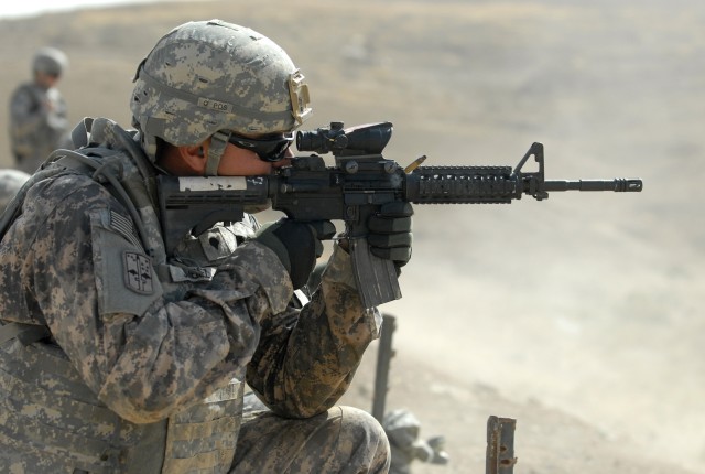 FOB MAREZ, Iraq -Spc. Francisco Jimenez, an infantryman assigned to the Personal Security Detail, 4th Advise and Assist Brigade, 1st Cavalry Division, fires a round from his M4 at a small arms range near Mosul, Iraq, Sept. 29. Jimenez, a native of...