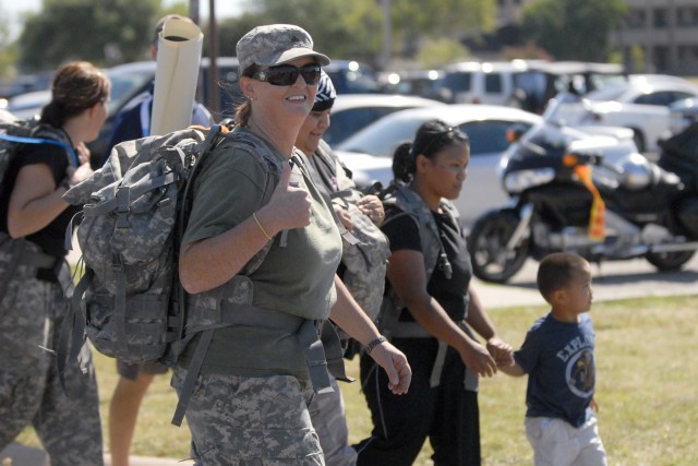 FORT HOOD, Texas- Mindy Fogelberg, a family readiness group leader with Headquarters and Headquarters Company, 3rd Brigade Special Troops Battalion, 3rd Brigade Combat Team, 1st Cavalry Division, participates in a mile long foot march as part of the ...