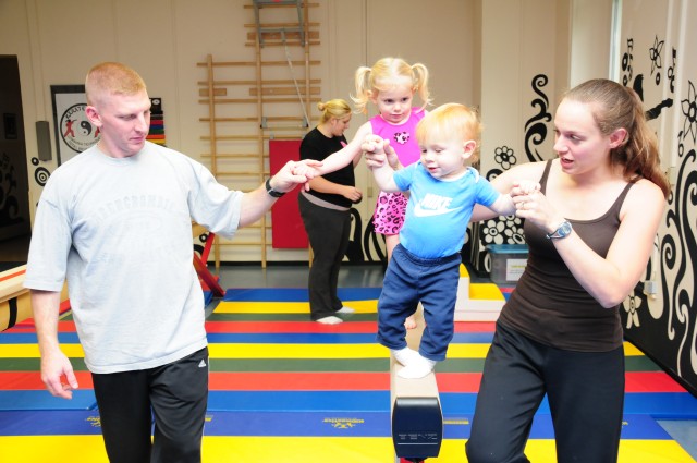 Moms, pops and tots tumble and twirl