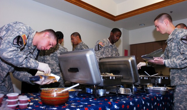 TEMPLE, Texas-Soldiers from Headquarters and Headquarters Company, 2nd Brigade Combat Team, 1st Cavalry division, prepare breakfast tacos during a fundraising event at the William R. Courtney Texas State Veterans Home, in Temple, Texas, Oct. 12. ...