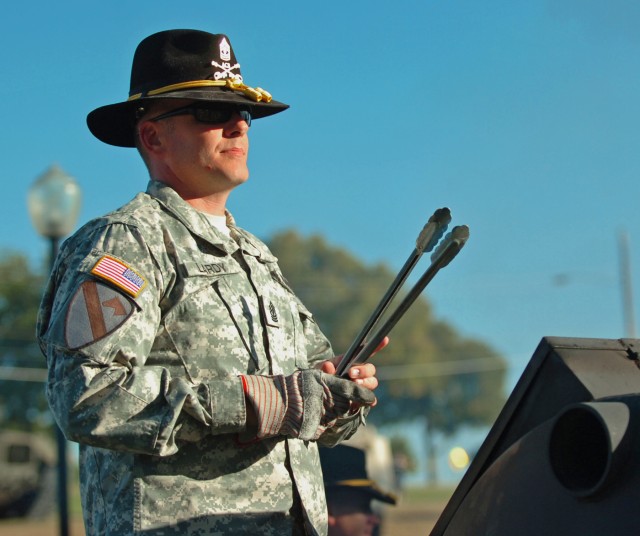 FORT HOOD, Texas - 1st Sgt. Joel Lardy, Company B, 3rd Battalion, 227th Aviation Regiment, 1st Air Cavalry Brigade, 1st Cavalry Division, stands ready to turn sausages, Oct. 12, before a concert held by the division's Jazz Band at the First Team's...