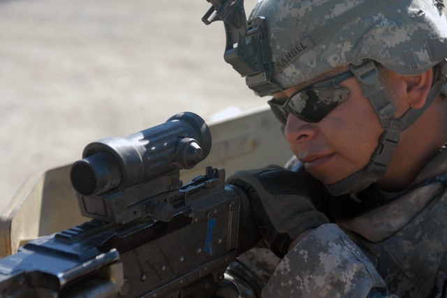 FORT HOOD, Texas - Comstock, Texas native, Sgt. Javier Rangel, a team chief assigned to Headquarters and Headquarters Company, 2nd Battalion, 8th Cavalry Regiment, 1st Brigade Combat Team, 1st Cavalry Division, prepares to fire an M240 machine gun at...