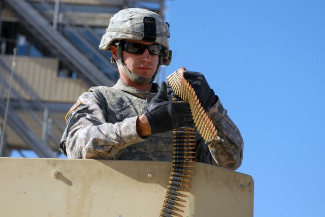 FORT HOOD, Texas - Prescott Valley, Ariz. native, Spc. Travis Selinsky, a gunner assigned to Company B, 2nd Battalion, 8th Cavalry Regiment, 1st Brigade Combat Team, 1st Cavalry Division, prepares rounds for the M240 machine gun for the unstabilized ...