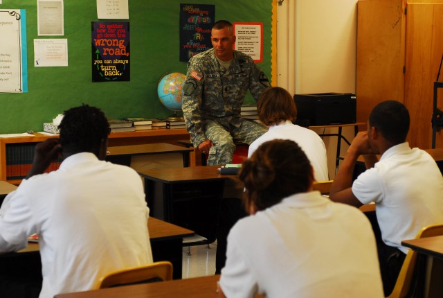 FORT HOOD, Texas- Students from Haynes High School listen to Command Sgt. Maj. Kenneth Agueda, 4th Squadron, 9th Cavalry Regiment, 2nd Brigade Combat Team,1st Cavalry Division, as he talks about his experiences growing up on the streets of Puerto Ric...