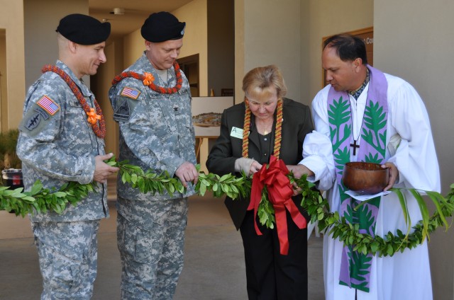 FORT SHAFTER FLATS, Hawaii -- From left, Col. Michael A. Phipps, commander of the Theater Support Group; Col. Tim Schroth, deputy commander of the 9th Mission Support Command; Army Reserve Ambassador P. Pasha Baker; and Kahu Kordell Kekoa untie a...