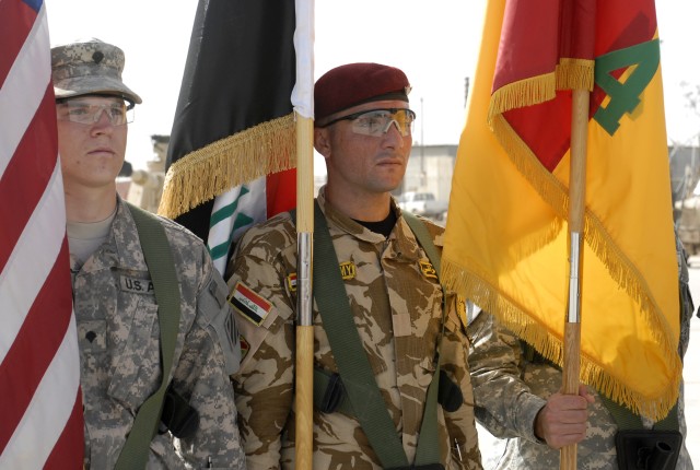CONTINGENCY OPERATING SITE MAREZ, Iraq -An Iraqi Soldier (center), a part of the color guard, stands next to the 4th Advise and Assist Brigade, 1st Cavalry Division's, colors after it's uncasing during a transfer of authority ceremony, Oct. 18....