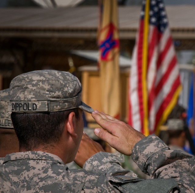 Soldiers render honors to the flag