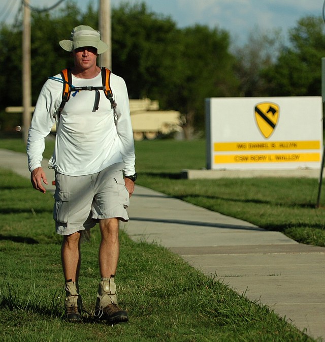 FORT HOOD, Texas-Lt. Col. Jack Usrey, personnel officer for the 1st Cavalry Division, walks past the division's headquarters during one of his many training walks.  Usrey, a Martin, Tenn. native, plans on completing a 100 mile trek in less than 48 ho...