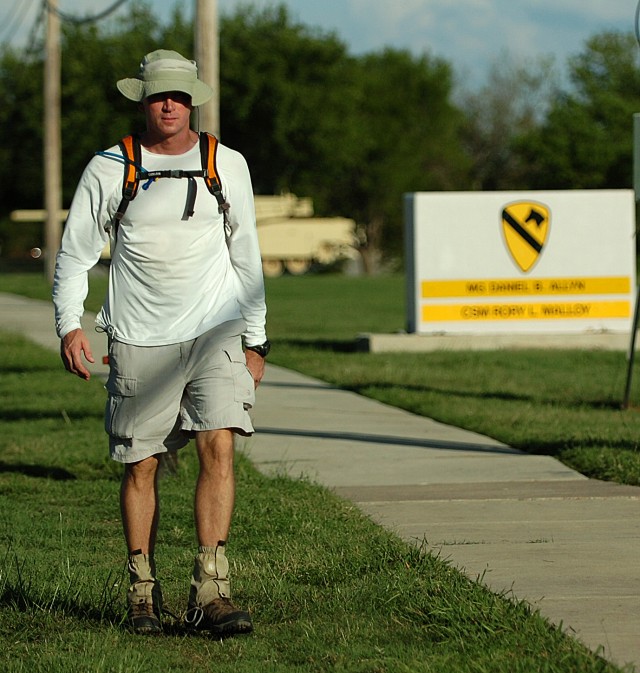 FORT HOOD, Texas-Lt. Col. Jack Usrey, personnel officer for the 1st Cavalry Division, walks past the division's headquarters during one of his many training walks.  Usrey, a Martin, Tenn. native, plans on completing a 100 mile trek in less than 48...