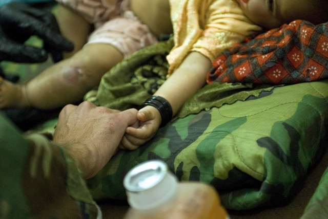 Afghan baby healed through coalition partnership