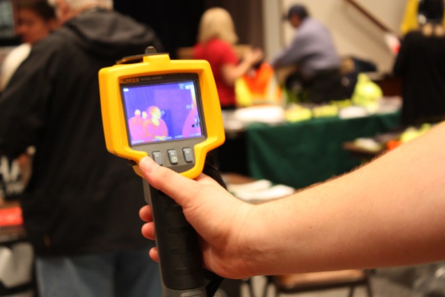 PICATINNY ARSENAL, N.J. — Justin Holzmann of Fluke Corporation demonstrates the use of a Ti32 thermal imager during a safety fair here Oct. 6.  Holzmann said the imager can be used in rescue and recovery missions allowing the user to detect heat and ...