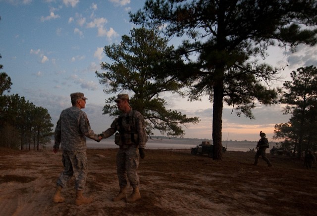 Chief of Staff of the US Army, Gen. George W. Casey Jr.,  talks with a Soldier while observing a Full Spectrum Operation exercise in Ft. Polk, LA, Saturday, Oct. 23, 2010.  The Full Spectrum exercise focuses on facing and defeating a hybrid threat re...