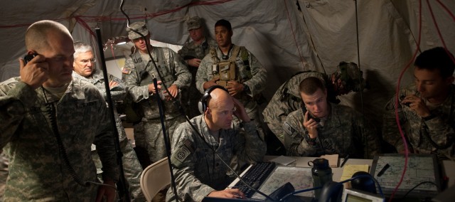 A command staff operates while the Chief of Staff of the US Army, Gen. George W. Casey Jr., observes the scenario during a Full Spectrum Operation exercise in Ft. Polk, LA, Saturday, Oct. 23, 2010.  The Full Spectrum exercise focuses on facing and de...