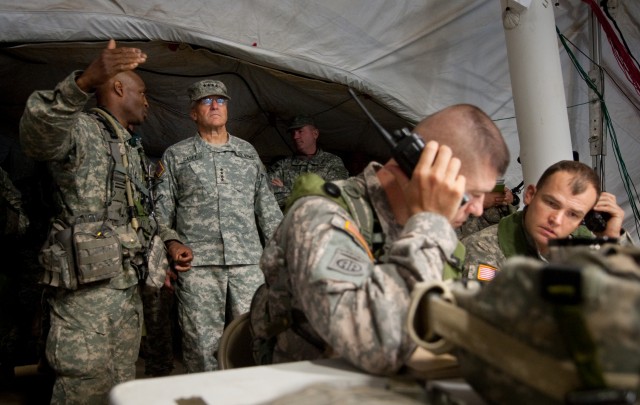 Col. Carl Alex, commander of the 3rd Brigade Combat Team, 82nd Airborne Division, briefs Chief of Staff of the US Army, Gen. George W. Casey Jr.,  about operations being conducted as part of the Full Spectrum Operation exercise in Ft. Polk, LA, Satur...
