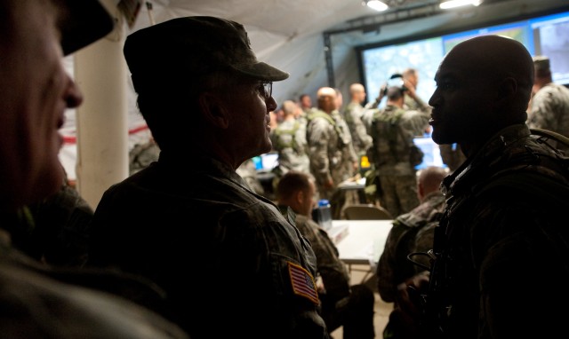 Col. Carl Alex, commander of the 3rd Brigade Combat Team, 82nd Airborne Division, briefs Chief of Staff of the US Army, Gen. George W. Casey Jr.,  about operations being conducted as part of the Full Spectrum Operation exercise in Ft. Polk, LA,...