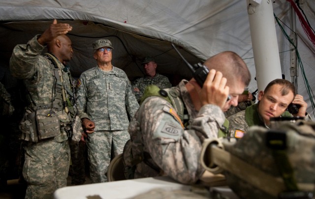 Col. Carl Alex, commander of the 3rd Brigade Combat Team, 82nd Airborne Division, briefs Chief of Staff of the US Army, Gen. George W. Casey Jr.,  about operations being conducted as part of the Full Spectrum Operation exercise in Ft. Polk, LA,...