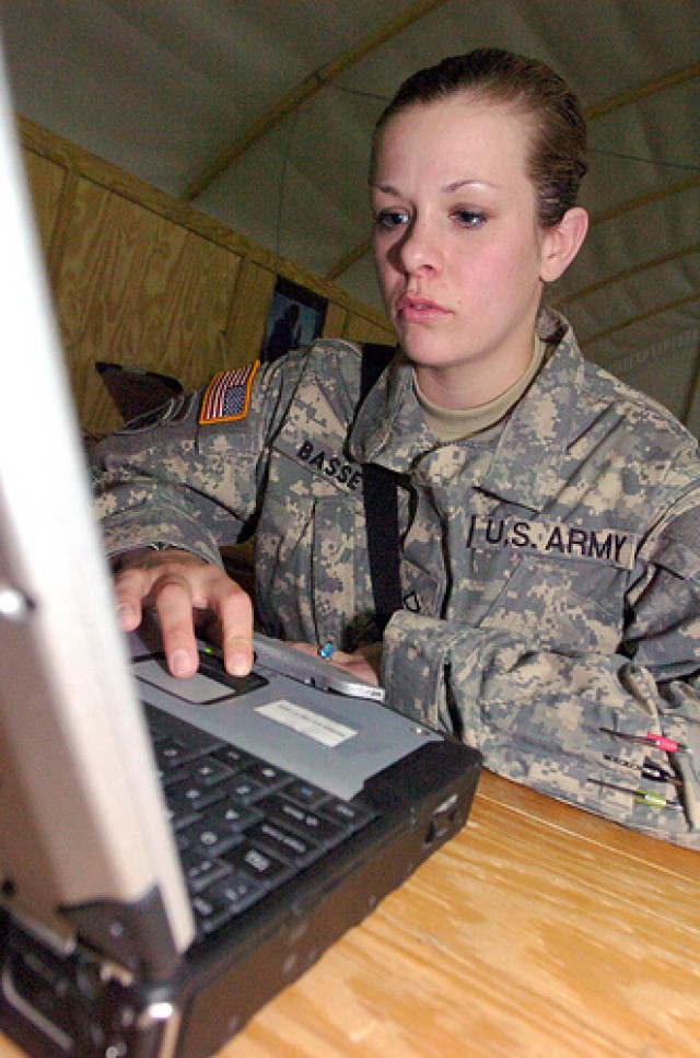 Soldier using a laptop computer