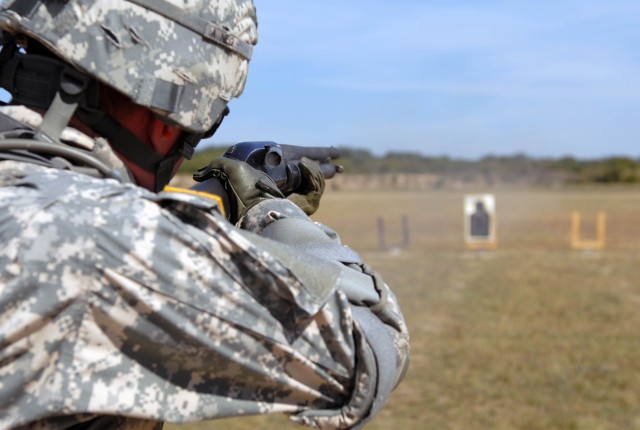 FORT HOOD, Texas - Meridan, Miss. Native, Spc. Clifford Bielefeld, a petroleum supply specialist assigned to the 115th Brigade Support Battalion, 1st Brigade Combat Team, 1st Cavalry Division, prepares to fire his shotgun at the Pilot Knob Rifle A Ra...