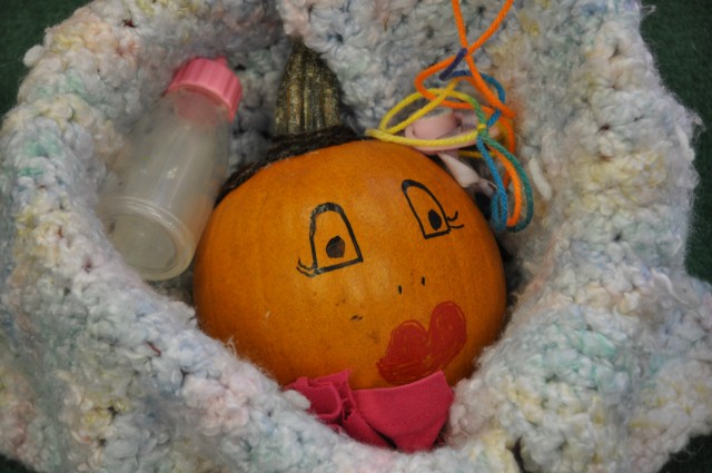 Bundle of joy: Second-graders play parents  to pumpkins
