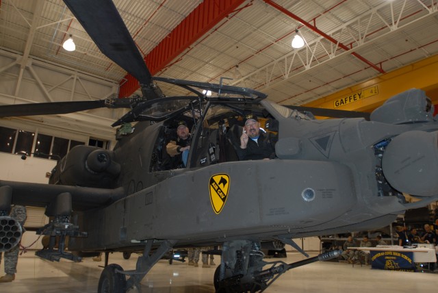 FORT HOOD, Texas - Jim Cody (left) and Zach Owen, hosts of the Zach and Jim Show on WACO 100 FM, broadcast live from an AH-64D Apache attack helicopter, here, Nov. 4. The broadcast was held in front of Soldiers from the 1st Air Cavalry Brigade,...