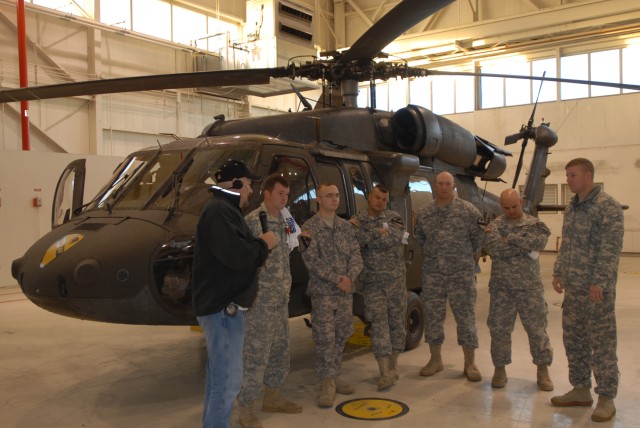 FORT HOOD, Texas -Soldiers from the 3rd Assault Helicopter Battalion, 227th Aviation Regiment, 1st Air Cavalry Brigade, 1st Cavalry Division, get interviewed by Zach Owen, one of the hosts of the Zach and Jim Show on WACO 100 FM during a live...